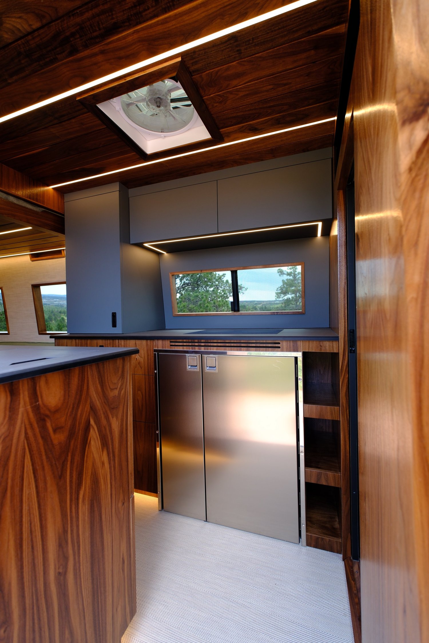 Bourbon kitchen with rich wood cabinetry and light upper cabinets