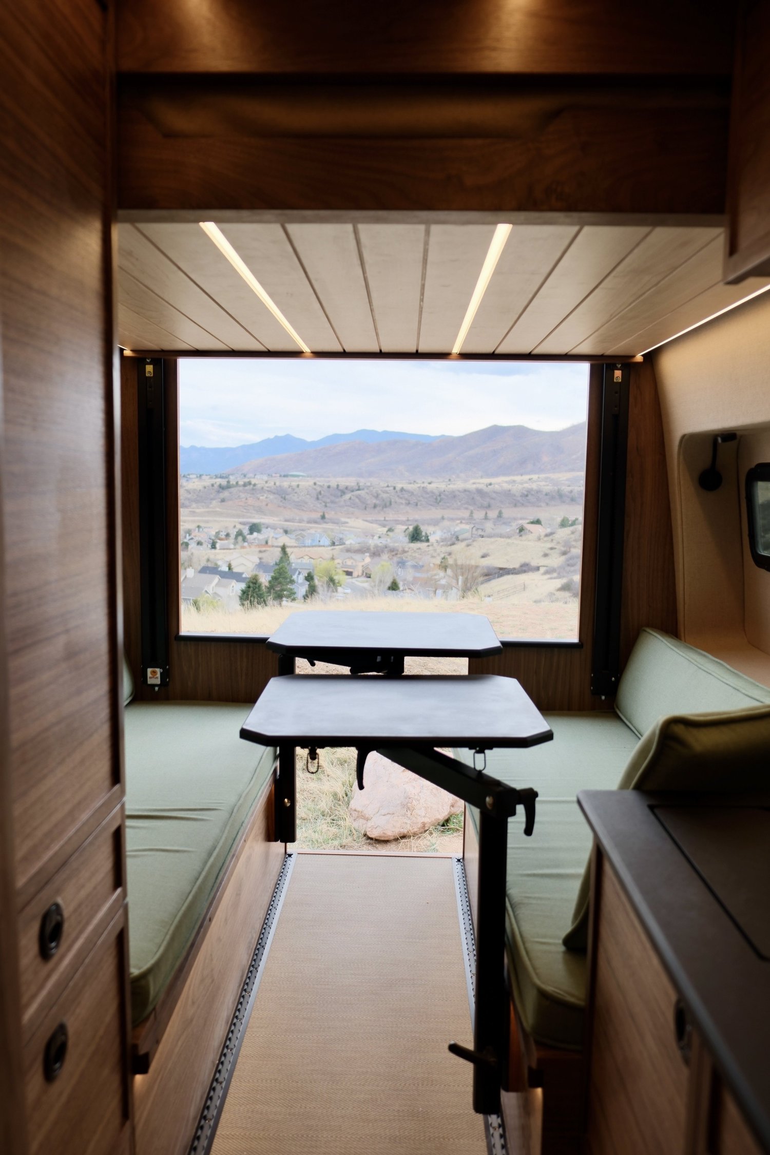 Timber rear dinette framed by wood cabinetry