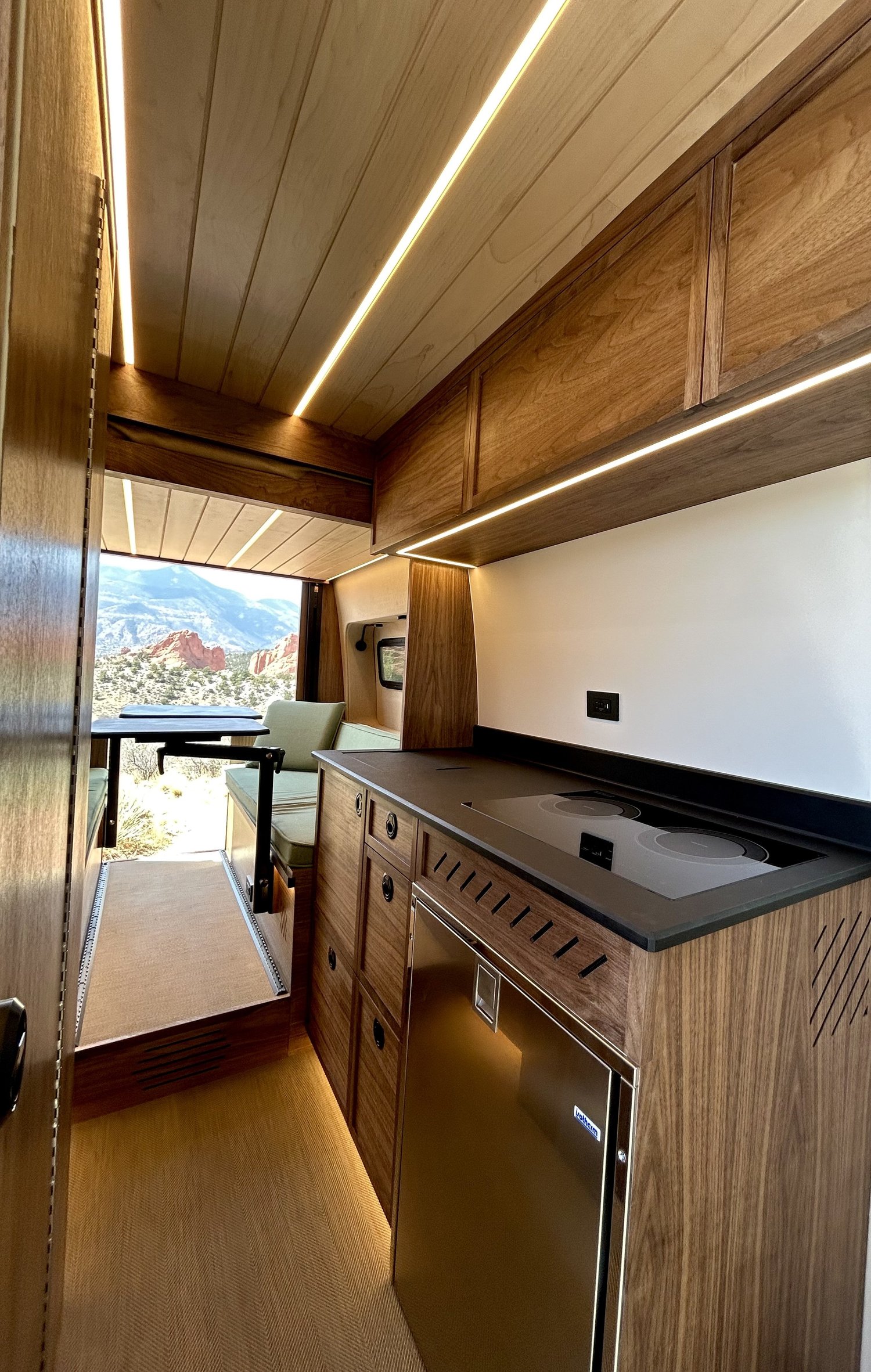 Natural wood cabinetry and a bright galley in Voyager’s Timber custom build