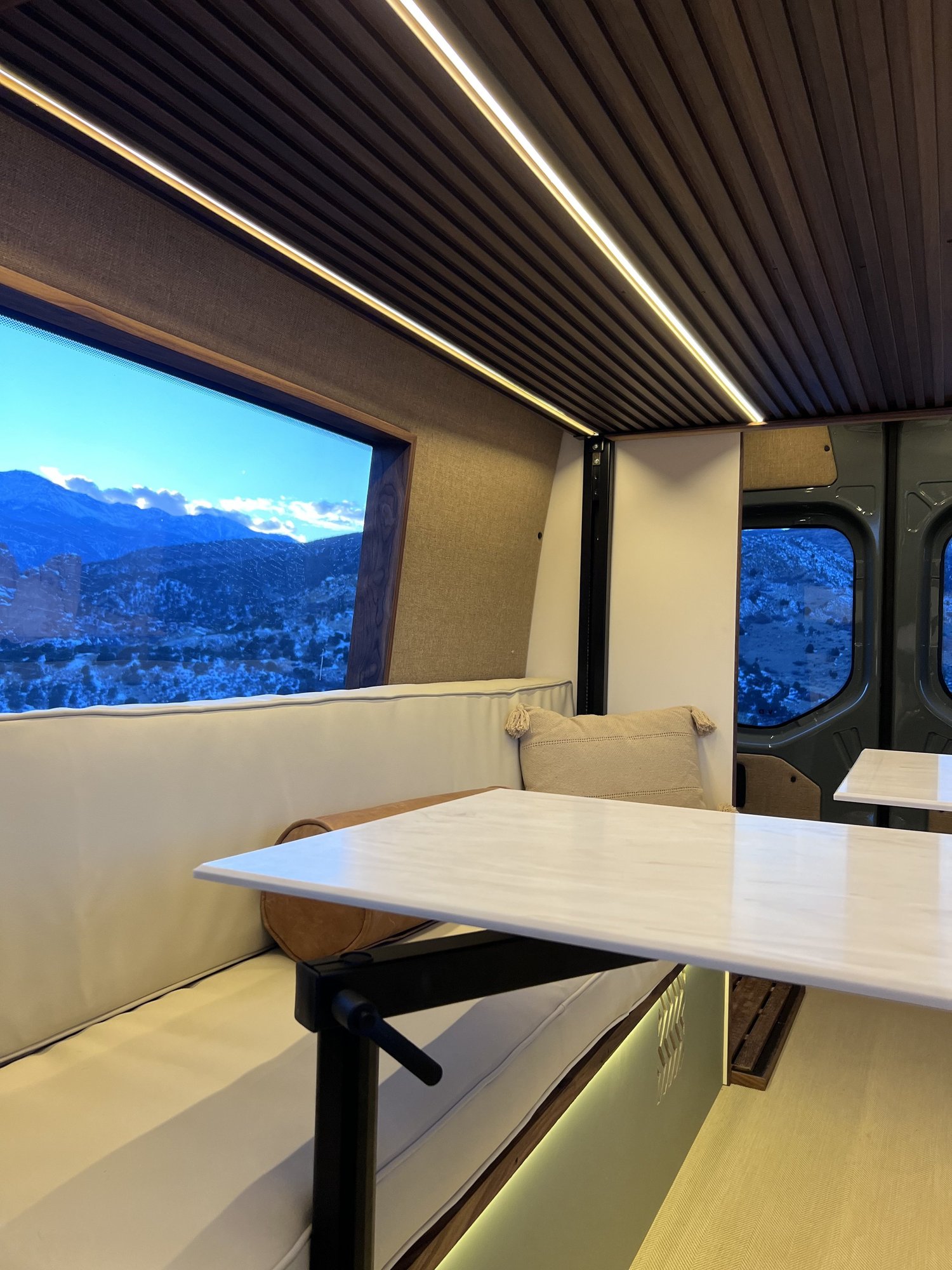 Twin Lakes dinette beneath a dark slatted ceiling