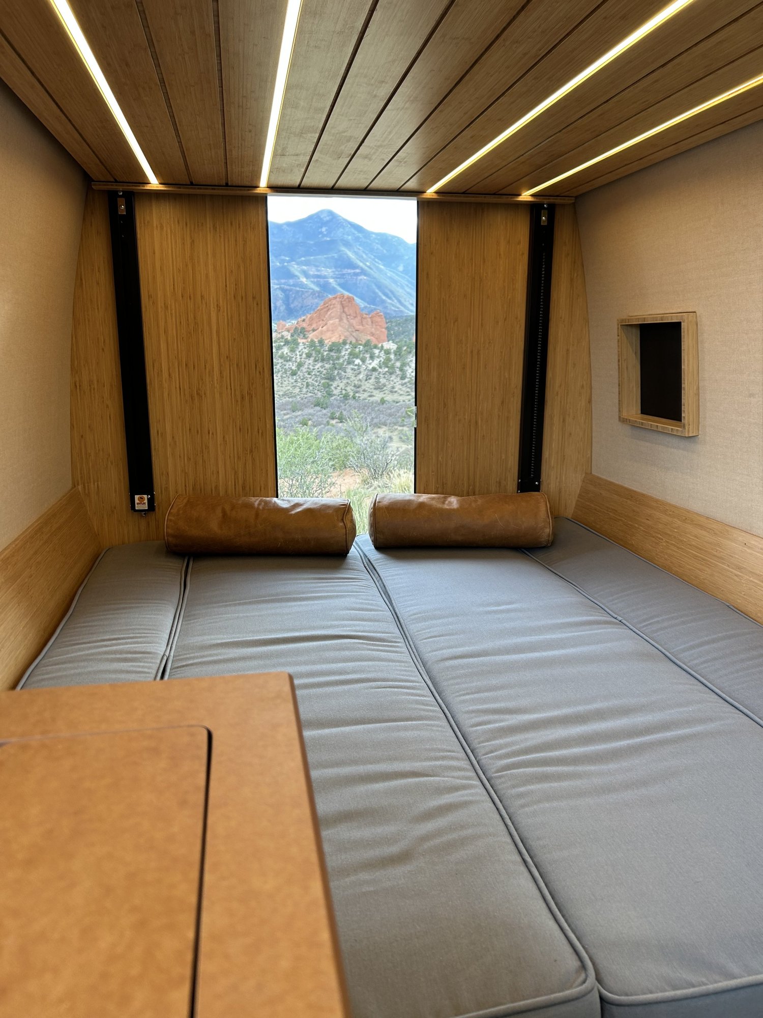 The Den dinette converted to a lower bed beside the rear doorway.