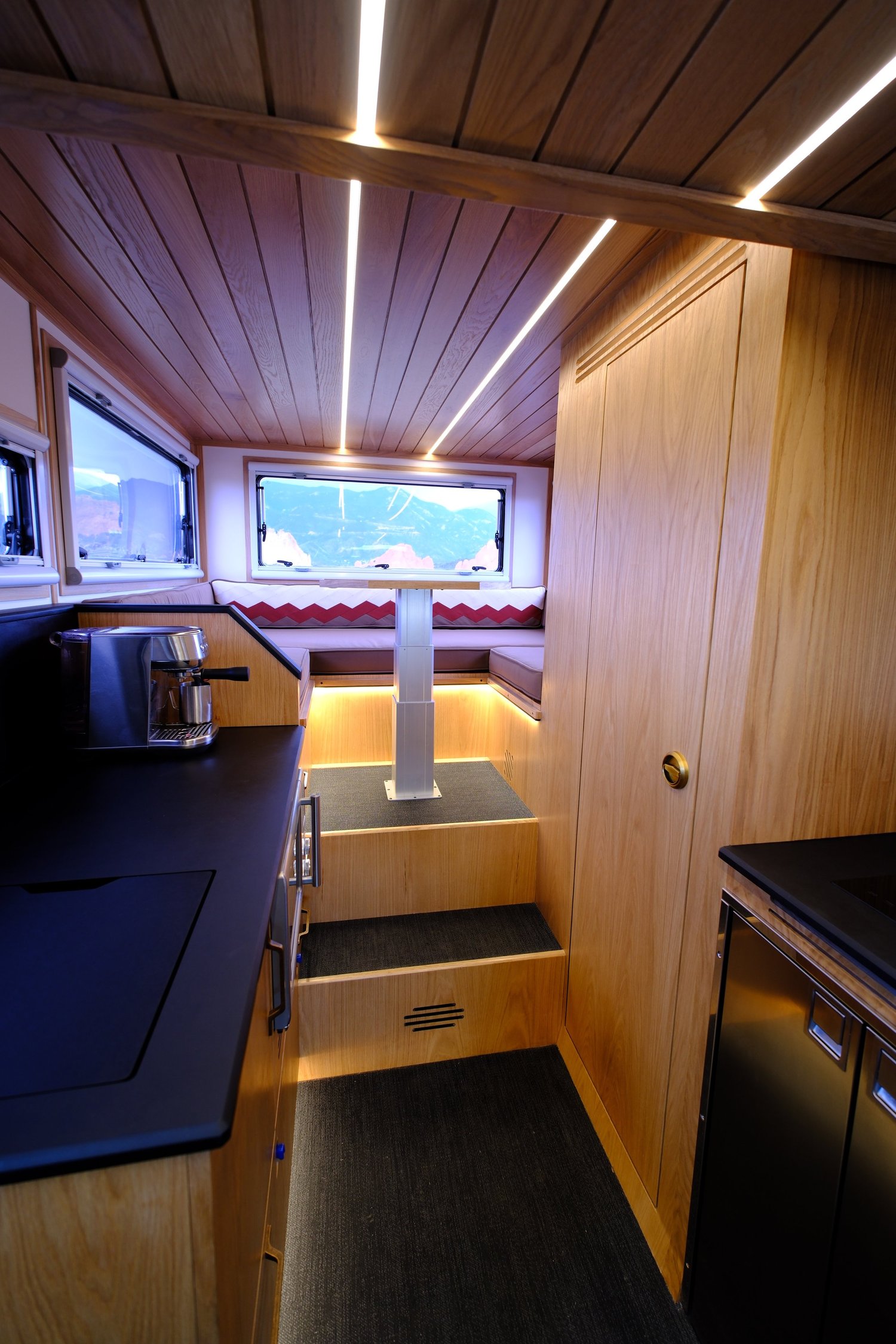 The Nest’s wide central aisle, galley, and separate rear dinette